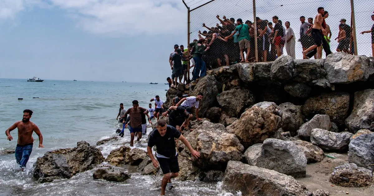 Tragic Migrant Crisis Unfolds at Ceuta Border: 18 Lives Lost in Chaotic Surge